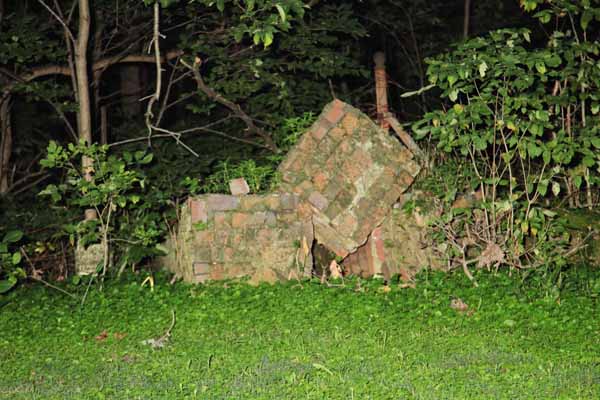 Here is a shot of that brick work. Nature has definately taken it's toll to the point that one can hardly tell what it use to be. Was it a Crypt? Was it a care takers shed? Was it something else?