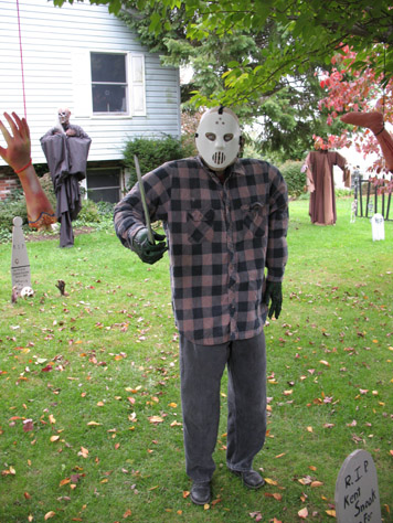 Just finished my Jason prop today.  He's a wood frame covered in some foam for padding and lots of old clothes.  The undermask was one I used for my pirate last year, and the hockey mask is just one of the cheap-o ones I've had for years.  The hands don't really match (they're green), but I'm trying to use up all the stuff I've bought in past years before buying anything new.